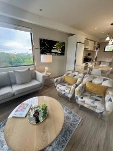 Posezení v ubytování 214 Executive Suite,