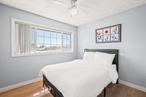 a bedroom with a bed and a window at Near ONT Ontario Oasis Designer Home w Garden Park in Ontario