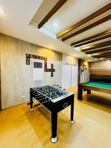 Комнаты для игр в Elaris Suite Tagaytay 1Br WI-FI,PS4,Netflix&Kitchen