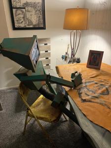 a wooden table with a box on top of it at Charming room in artist studio and Gallery in Santa Clarita