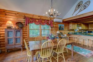 a dining room with a table and chairs at Banner Bunks at River Run in Banner Elk
