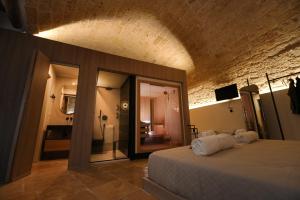 a bedroom with a large bed in a room at Myra Bari Bed & Spa in Bari