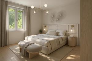 a white bedroom with a large bed and a window at Lake Lodge Ossiacher See in Annenheim