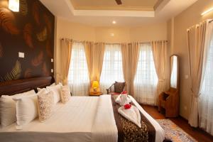 Ένα ή περισσότερα κρεβάτια σε δωμάτιο στο Elys luxury villa