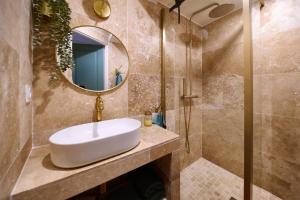 a bathroom with a sink and a mirror at Romantic getaway in Bormes in Bormes-les-Mimosas +15 photos