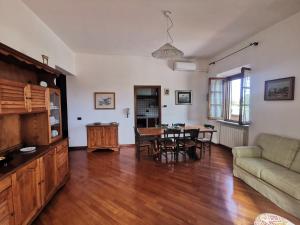 a living room with a couch and a table at La Terrazza di Maria in Pienza