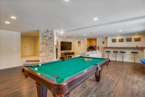 a living room with a pool table in it at Edson Hill Estate in Stowe