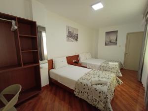 Giường trong phòng chung tại Misky Puñuy