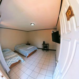 Postel nebo postele na pokoji v ubytování Hotel Geliwa