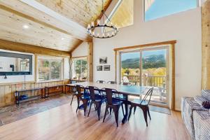 a dining room with a table and chairs at Riverfront Lodge in Pagosa Springs