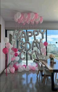 a room with a bunch of pink and white balloons at Luxury apartment overlooking the Arch in Cabo San Lucas +32 photos