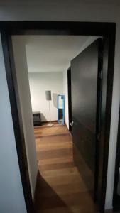 a hallway with a door leading into a room at casabosque habitacion301 in Bogotá