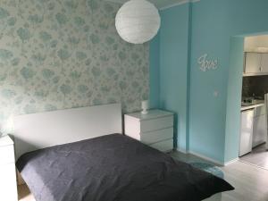 Posteľ alebo postele v izbe v ubytovaní Happy Mammy Bababarát Apartmanház 1 - Hűvös utca