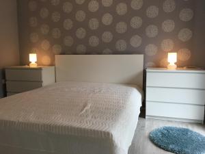 Posteľ alebo postele v izbe v ubytovaní Happy Mammy Bababarát Apartmanház 1 - Hűvös utca