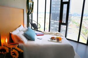Ένα ή περισσότερα κρεβάτια σε δωμάτιο στο Volcano View Loft, Puebla Skyline1801