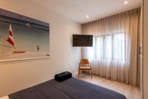 TV a/nebo společenská místnost v ubytování Palazzo 126 Luxury 5BR Pool Villa in Patong