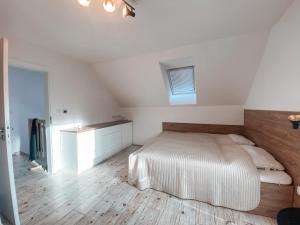 a bedroom with a bed and a wooden floor at Chalet Dolní Morava in Dolní Morava