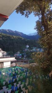 a view of a city from the top of a building at Freedom Palace -Mcleodganj in McLeod Ganj