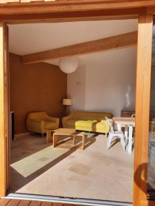 a living room with a couch and a table at Au blé dormant in Wihr-au-Val