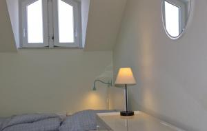 Ένα ή περισσότερα κρεβάτια σε δωμάτιο στο Inselblume 23 - Ferienwohnung mit 2 Balkonen und Meerblick