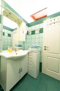 a bathroom with a sink and a mirror at Apartments Lili in Pag +51 photos