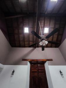 a ceiling fan in a room with a ceiling at Hotel Corazon de Granada in Granada