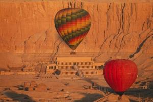 two hot air balloons flying over the acropolis at Adream partment in Luxor in Luxor