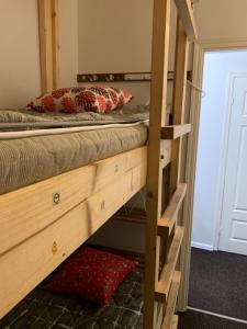 a bunk bed in a room with a wooden bunk bed at Artishalico tallinn in Tallinn +18 photos