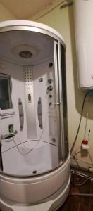 a white refrigerator with controllers on the side of it at Artishalico tallinn in Tallinn