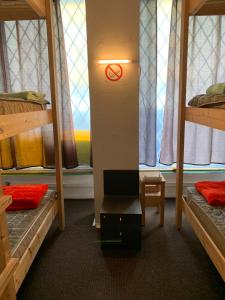 a room with two bunk beds and a window at Artishalico tallinn in Tallinn