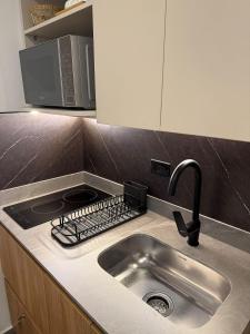 Η κουζίνα ή μικρή κουζίνα στο Bloom by Simple Stay