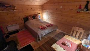 Postel nebo postele na pokoji v ubytování Lapland Snow Moose