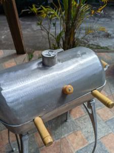 a metal table with a pot on top of it at Casa Singela in Miguel Pereira