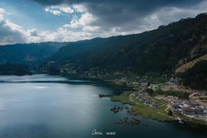 an aerial view of a lake in the mountains at Wenchi Eco-lodge in Dirē Kʼalu