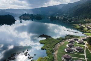 an aerial view of a lake with a group of resorts at Wenchi Eco-lodge in Dirē Kʼalu