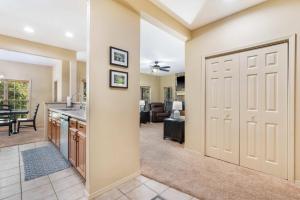 a kitchen and living room with a garage door at Stonebridge Hideaway - For 6 in Branson West