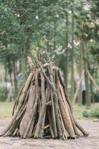 a pile of tree branches forming a structure at V-Eco Nest in Thạch Cầu