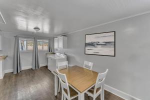 a kitchen and dining room with a table and chairs at The Main Lineup 2 - All Star Baseball Rentals in Oneonta