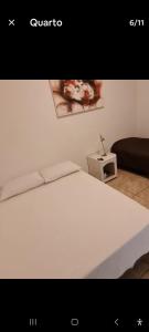 Ένα ή περισσότερα κρεβάτια σε δωμάτιο στο Casarão Lima Duarte