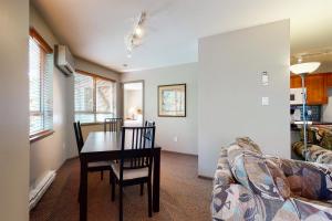 a living room with a table and a couch at Town Plaza, Unit 256 in Whistler