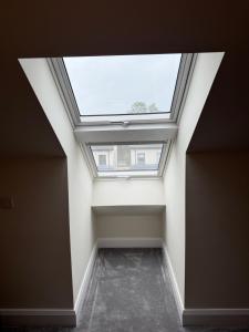 a skylight in an empty room with a ceiling at Birch view getaway in Dunshaughlin