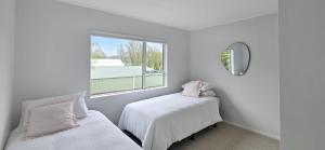 Ένα ή περισσότερα κρεβάτια σε δωμάτιο στο Orchard View Villa - Gateway To Abel Tasman +12 φωτογραφίες