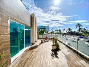 a balcony of a building with a view of the water at Casa Vista Mar com piscina na Orla De Atalaia in Santa Maria