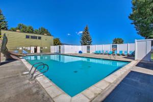 a swimming pool with blue water at Mtn and Lake Views Family Retreat in Garden City! in Garden City