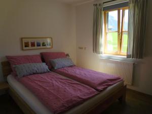 Ένα ή περισσότερα κρεβάτια σε δωμάτιο στο Appartements gosaukamm.com