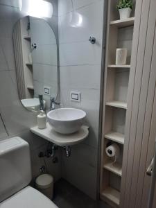 a bathroom with a sink and a mirror at Dunas I, 3 in Pinamar +38 photos