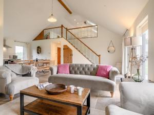 a living room with a couch and a table at 3 Bed in Talybont-on-Usk 88139 in Talybont