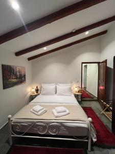 Postel nebo postele na pokoji v ubytování Aggelos Gardenhouse of Volos