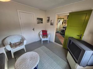 TV a/nebo společenská místnost v ubytování Kåfjord aurora northern light + 16 fotografií