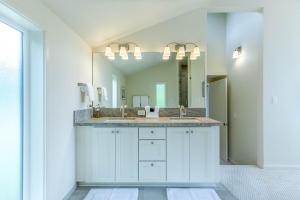 a bathroom with a sink and a large mirror at 3 min to UO with amazing views! Central to all! in Eugene +34 photos